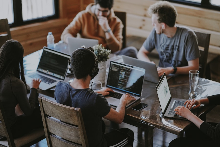 Product team collaborating around a laptop